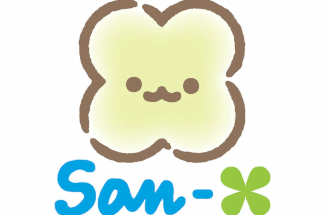 A cute, cartoonish clover with a smiling face and the text "San-x" below.